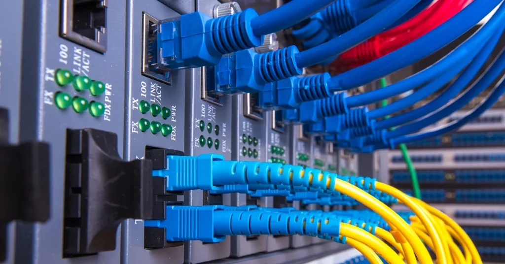Network Switches Connected With Fibre Optic Cabling And Cables
